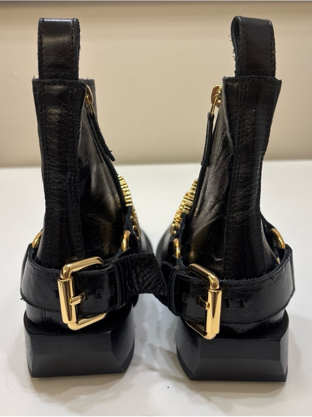 Never worn Moschino Black Leather Ankle Boots with Gold Logo Straps - Picture 5 of 6